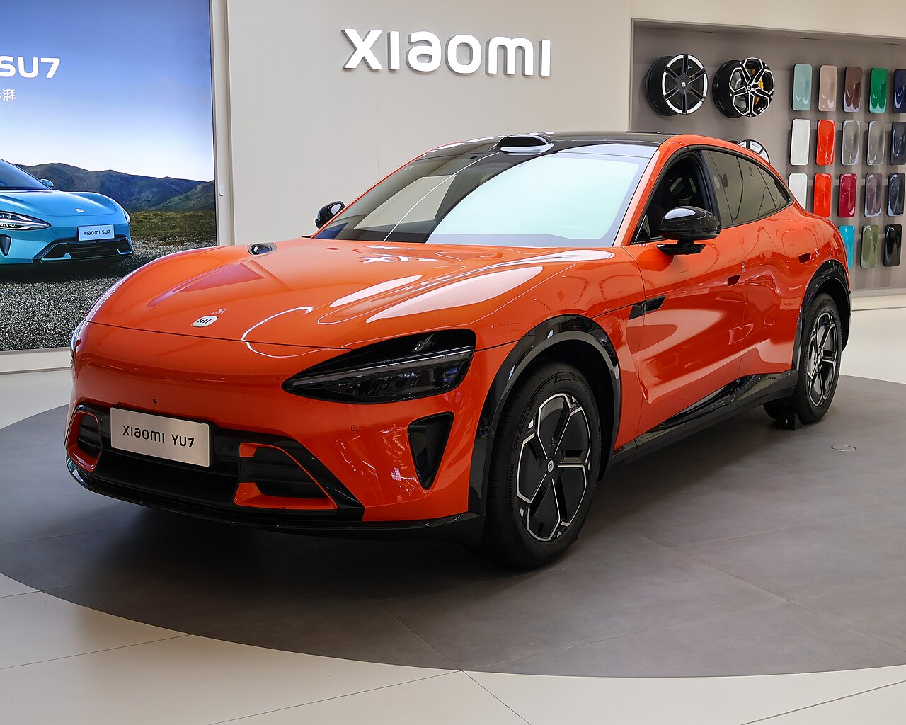 Orange Xiaomi YU7 SUV on display in a Xiaomi showroom in Shanghai