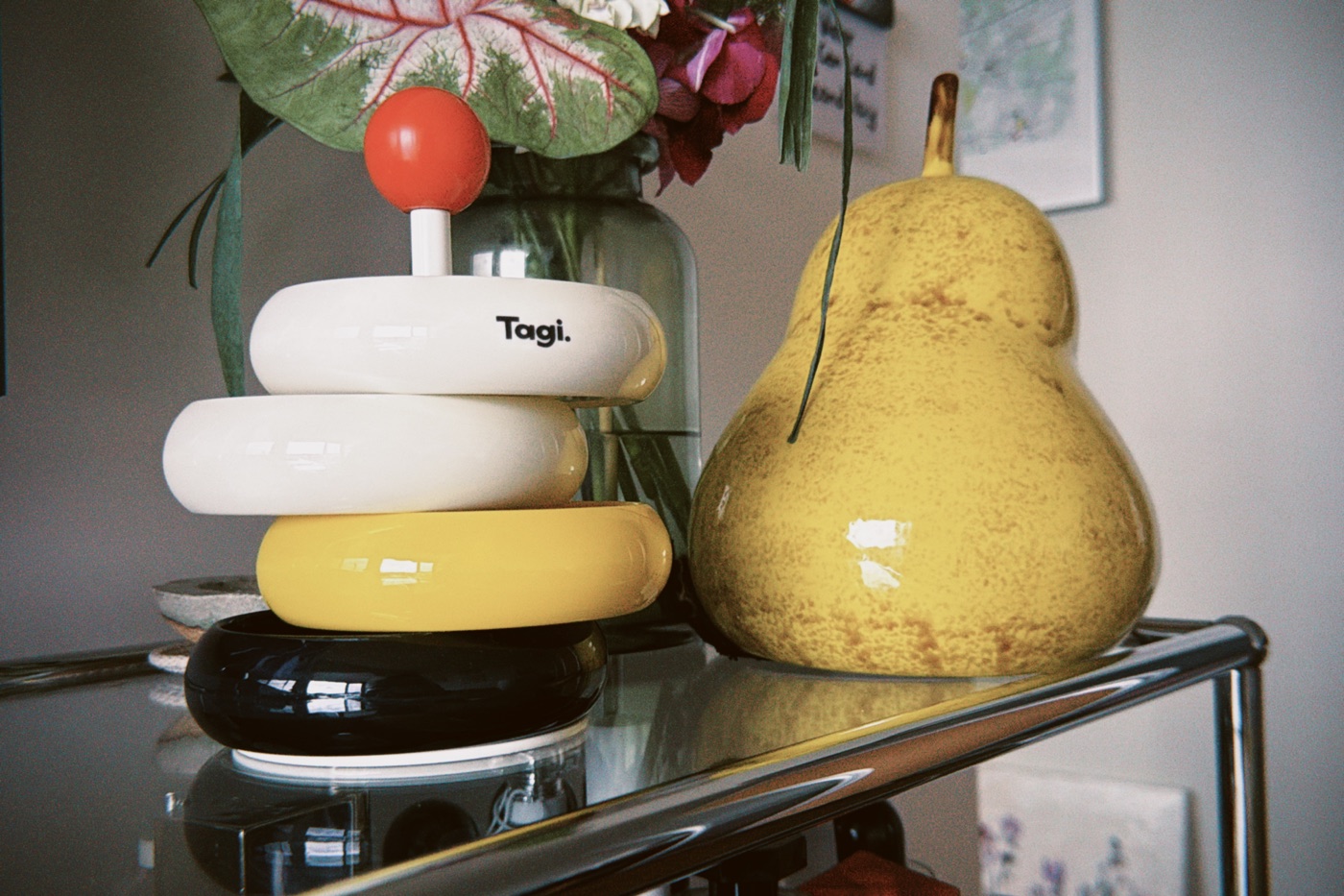 A sculptural Tagi object with stacked white, yellow and black rings