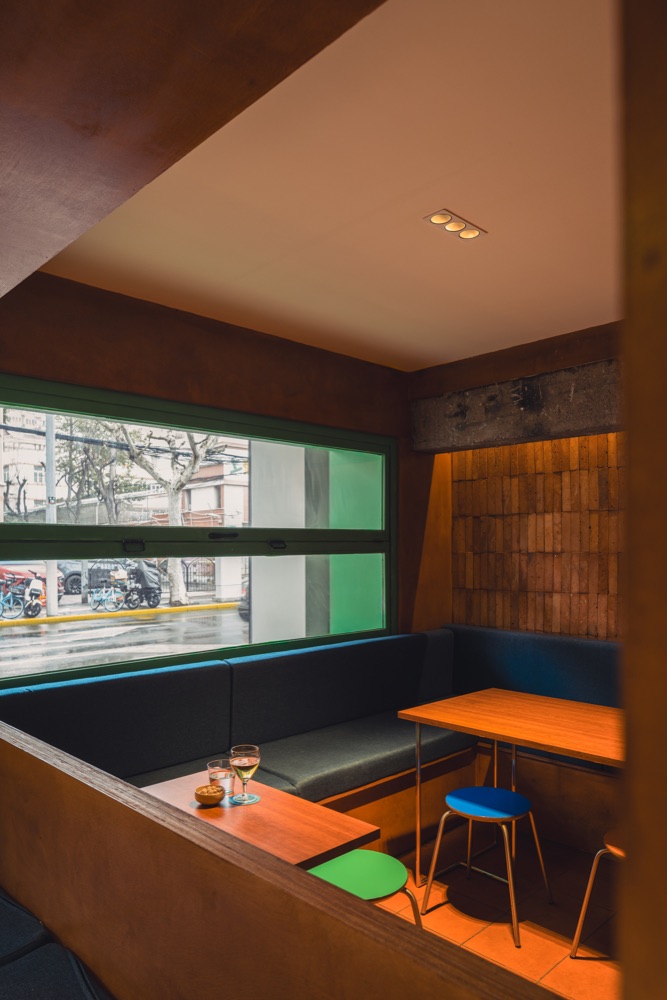 Window-side tables and seating at KuaTia