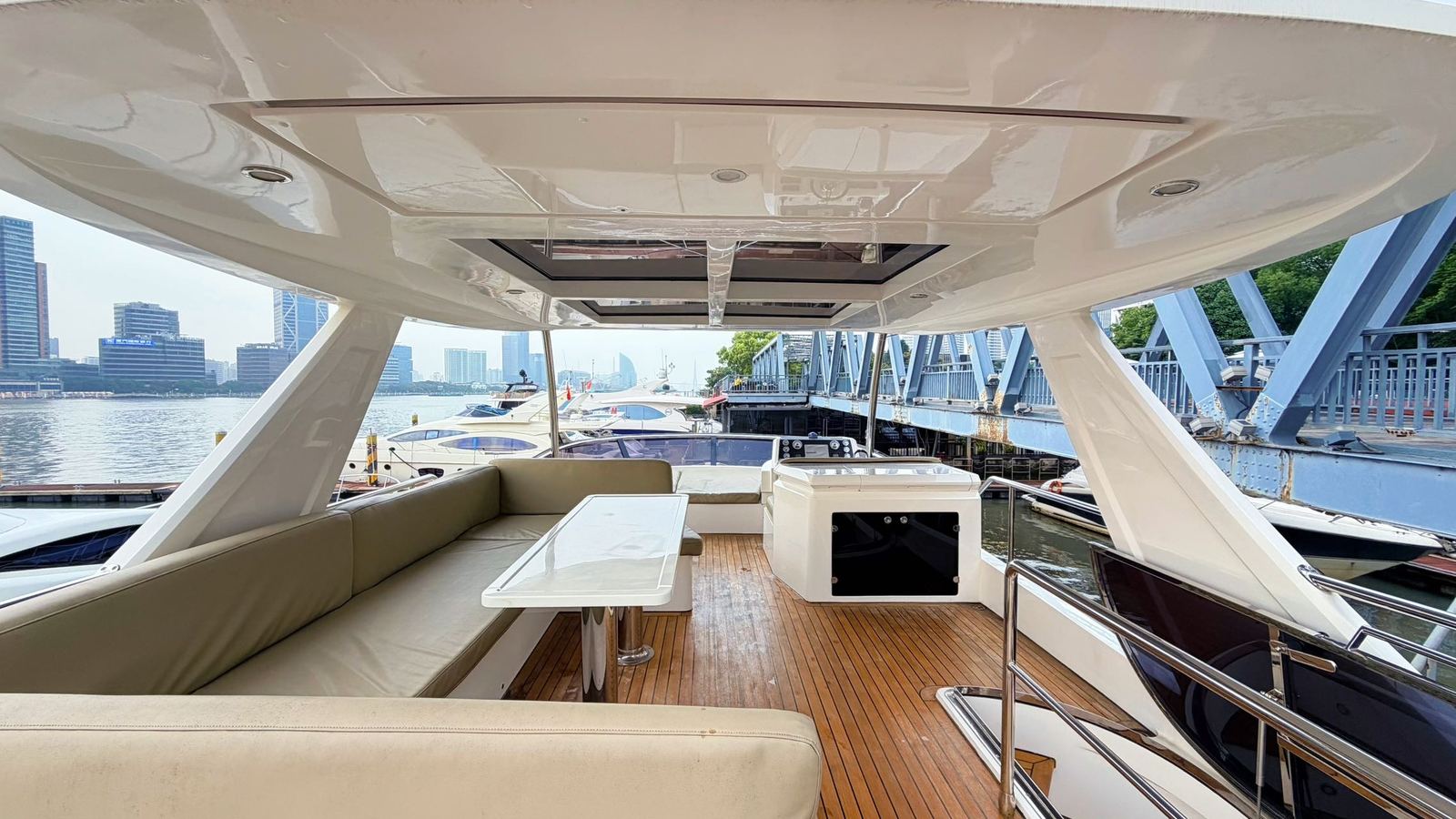 Covered upper deck and seating on the classic yacht during the day