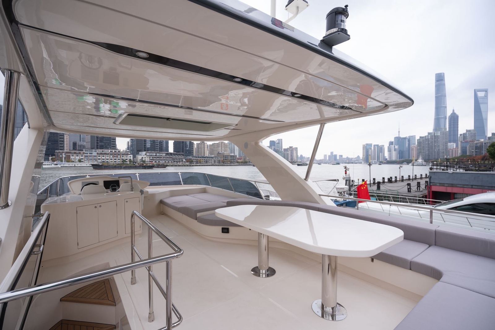 Upper deck seating of the 68-foot yacht overlooking the Huangpu River